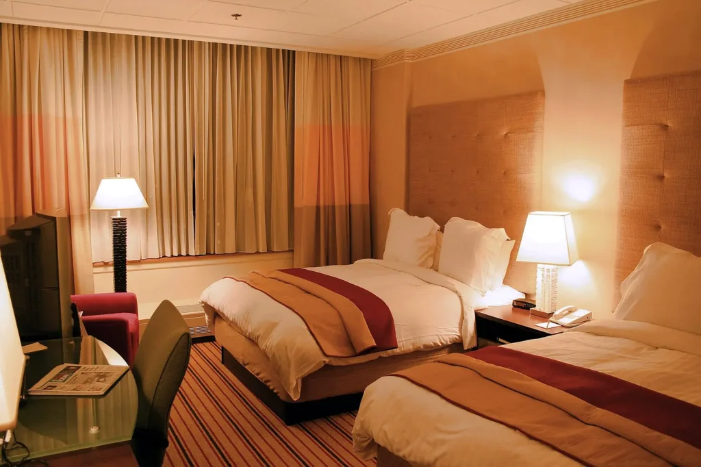 Made-up hotel guest room — the room-turnover environment hotel pest programs monitor across Polk County FL