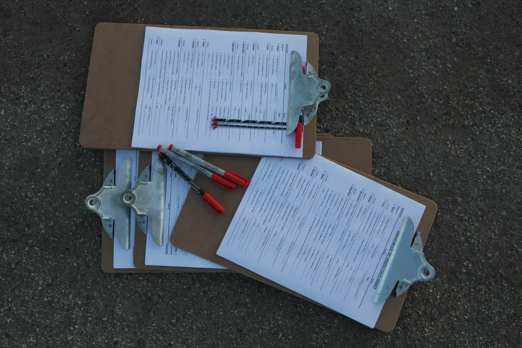 Inspection clipboards and checklists laid out side by side — comparing national chains against local Lakeland FL operators