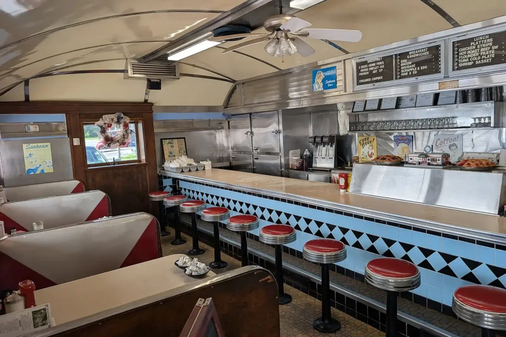 Classic diner dining room with booths and counter — the front-of-house image restaurant pest programs protect in Polk County FL