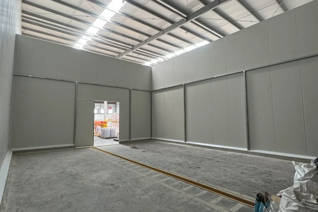 Open warehouse floor with pallet staging — the dock-door and racking zones warehouse pest control covers in Lakeland FL